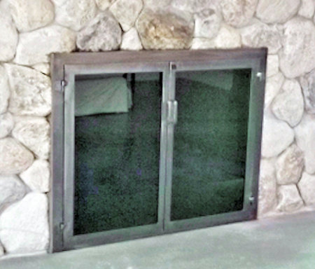 boxed frame falmouth square all natural iron finish, twin doors with pain handles and smoked glass on river rock